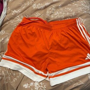 Adidas Squadra 25 soccer shorts in orange with white stripes and trim